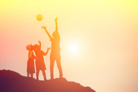 silhouette of a happy family and happy time sunsetの写真素材