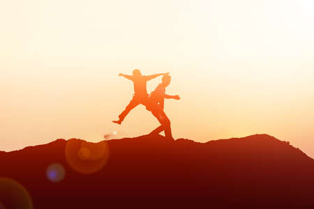 silhouette of a happy children and happy time sunsetの写真素材