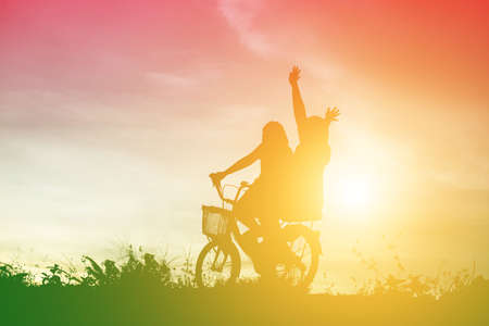silhouette of a happy children and happy time sunsetの写真素材