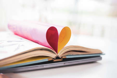 A heart shaped folded paper representing pink love
