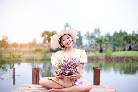 Beauty young woman with flowers and make up close , real spring girlの写真素材