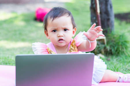 The daughter relaxes with bright eyes.の写真素材
