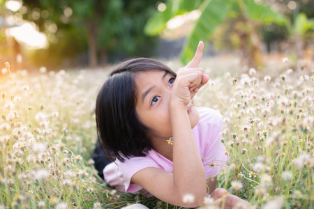 child little girl with  reading a booksの写真素材