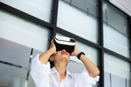 Young girl play virtual reality game hold vr glasses and surprised. Cyber space and virtual gaming