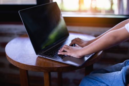 Businesswomen typing keyboard on labtop or notebook, business online concept.の写真素材