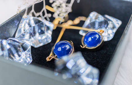 This is our own handmade earring. Blue round beads, stones similar to sapphire, beautiful texture....