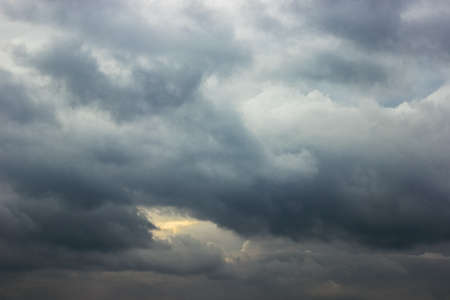 In the evening, the sky was very thick with many clouds. The clouds enclosed the sky as if there was...