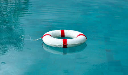 Lifebuoy floating in swimming pool