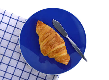 Croissant put on plate with  cloth on white backgroundの写真素材