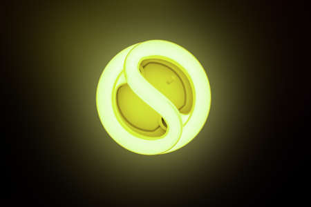 Included energy-saving lamp on a dark backgroundの写真素材
