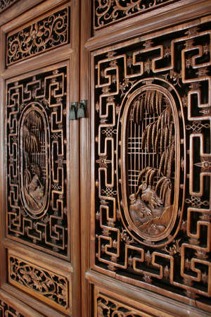 side view of door with wood carving decorの写真素材