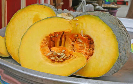 display of slices of golden pumpkinの写真素材