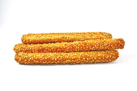 sesame coated breadsticks on white backgroundの写真素材