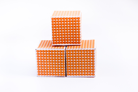 Montessori material , one thousand cube on white background , Golden Bead 1000 Cubeの写真素材