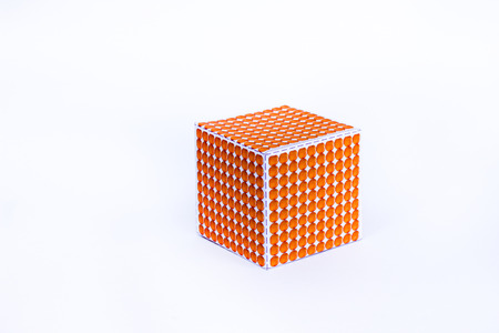 Montessori material , one thousand cube on white background , Golden Bead 1000 Cubeの写真素材