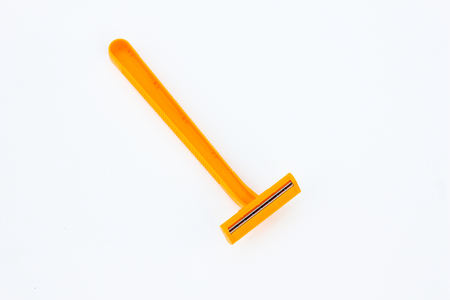 Yellow shaver on white backgroundの写真素材