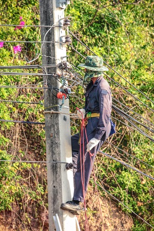 Electrician climb electric poleの写真素材