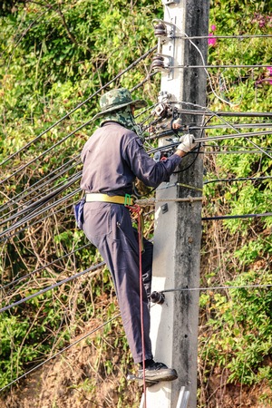 Electrician climb electric poleの写真素材