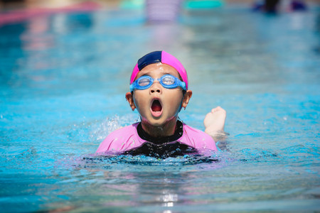 Children girl in swimming pool , Asian Gril , Thailandの写真素材