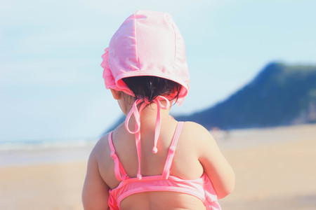 Two cute Asian girl playing sea water , Girl playing on the beach,thailandの写真素材