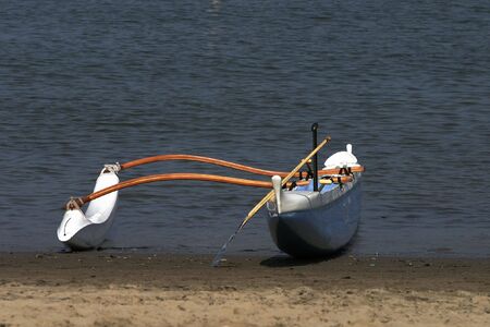 Outrigger canoe on the shore after the raceの写真素材