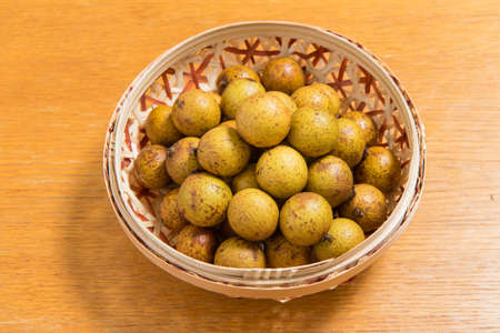 Fresh longan in Bamboo bowl