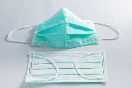 Unused medical face mask and used 
 medical face mask, coronavirus protection isolated on a white background,の写真素材