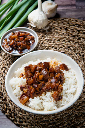 braised pork on rice is Minced pork served with pickles on top of steamed riceの写真素材