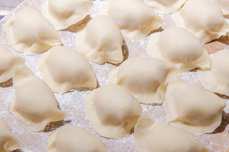 Boiled dumpling is Chinese dumplings or potstickers in boiling water. Dumpling is a dough and wrapped around a filling. The dough is flour and the filling is meat and vegetables.の写真素材