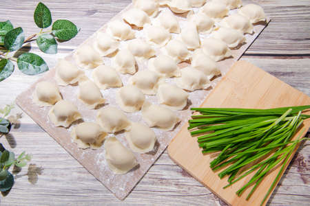 Boiled dumpling is Chinese dumplings or potstickers in boiling water. Dumpling is a dough and wrapped around a filling. The dough is flour and the filling is meat and vegetables.の写真素材