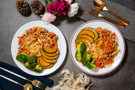Delicious tomato spaghetti on the table (Served with cauliflower, pumpkin, shiitake mushrooms) top viewの写真素材