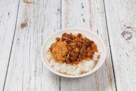 braised pork on rice is Minced pork served with pickles on top of steamed rice,の写真素材