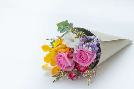 Beautiful and romantic bouquet on white background (rose, orchid, bellflower, gypsophila).の写真素材