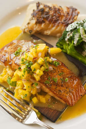 cedar plank cooked salmon with mango salsa,  brocccoli and potato