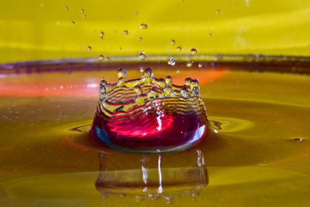 water splash isolated on yellow   redの写真素材