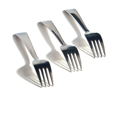 Three forks against white background. Cover set