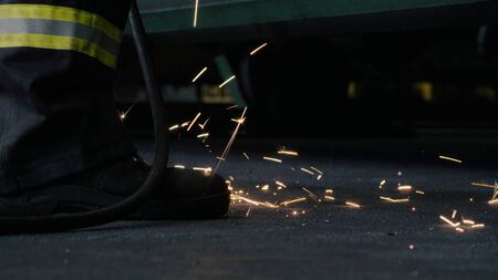 Close up of welding's sparks falling on the floor