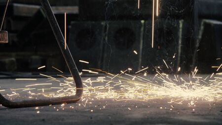 Close up of welding's sparks falling on the floor