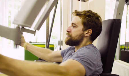 Face of disabled man doing hand exercises