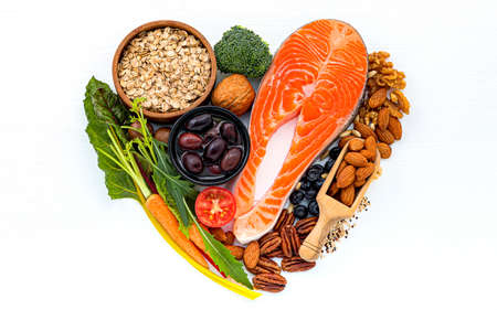 Heart shape of ingredients for healthy foods selection on white wooden background.の写真素材