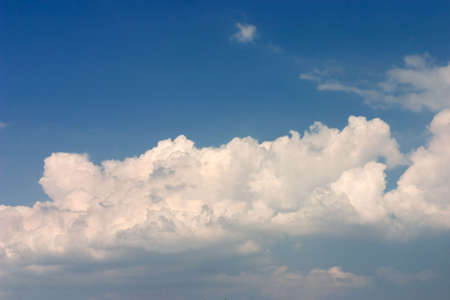 Deep blue sky with white clouds