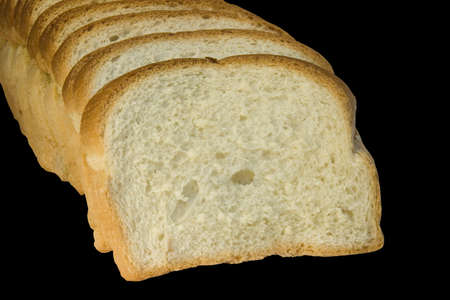 Slices of bread isolated on black background