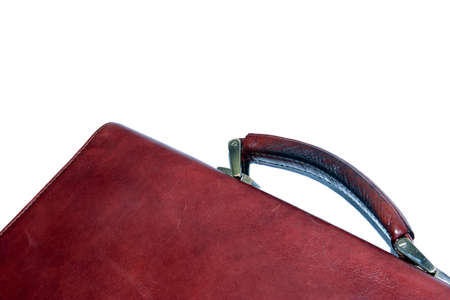 Old briefcase isolated on whiteの写真素材