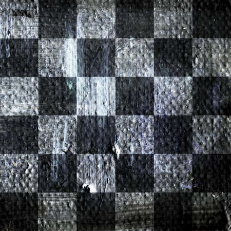 Abstract checkered pattern painted with acrylic or oil paints on canvas in black and white colors. Chessboard with a vintage texture for playing chess. Old surface from square fields for backgroundの写真素材