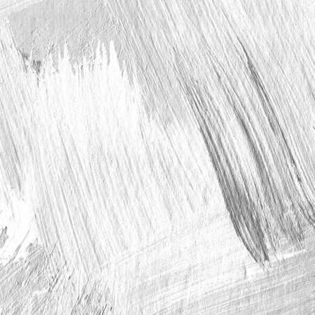 White painted textured abstract background with brush strokes in gray and black shades. Fragment of acrylic painting on canvas with brush strokes. Modern art.の写真素材