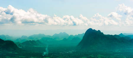 A  landscape of mountain ridges with sunset sky and clouds at Phu Kra Dung National park of Thailandの写真素材