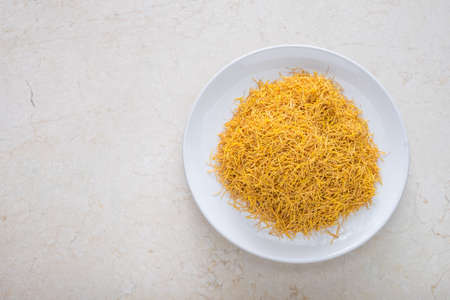 dried lotus pollen on the plate with spaceの写真素材