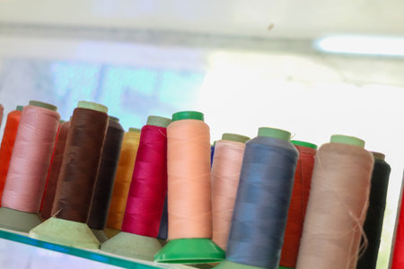 Colorful threads in the sewing shop create a vibrant atmosphere.の写真素材
