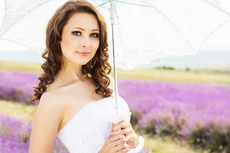 Beautiful bride posing at field of lavenderの写真素材