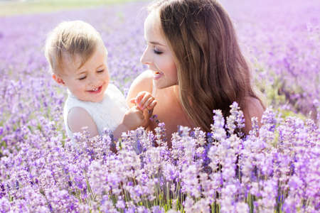 Mother and gaughter playing in lavender fieldの写真素材